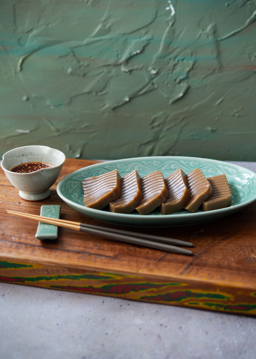 Sliced dotori muk (Korean acorn jelly) served with savory Korean dipping sauce.