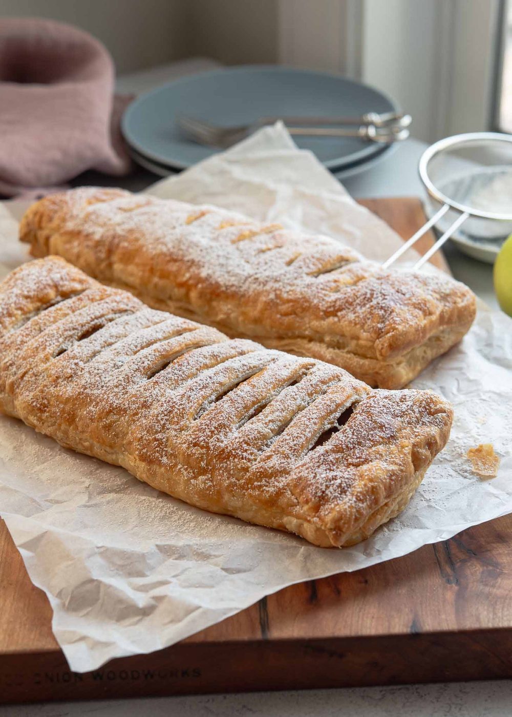 Kitchen-made apple strudel made with puff pastry, golden and flaky
