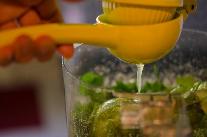 Squeezing juice out of lime.