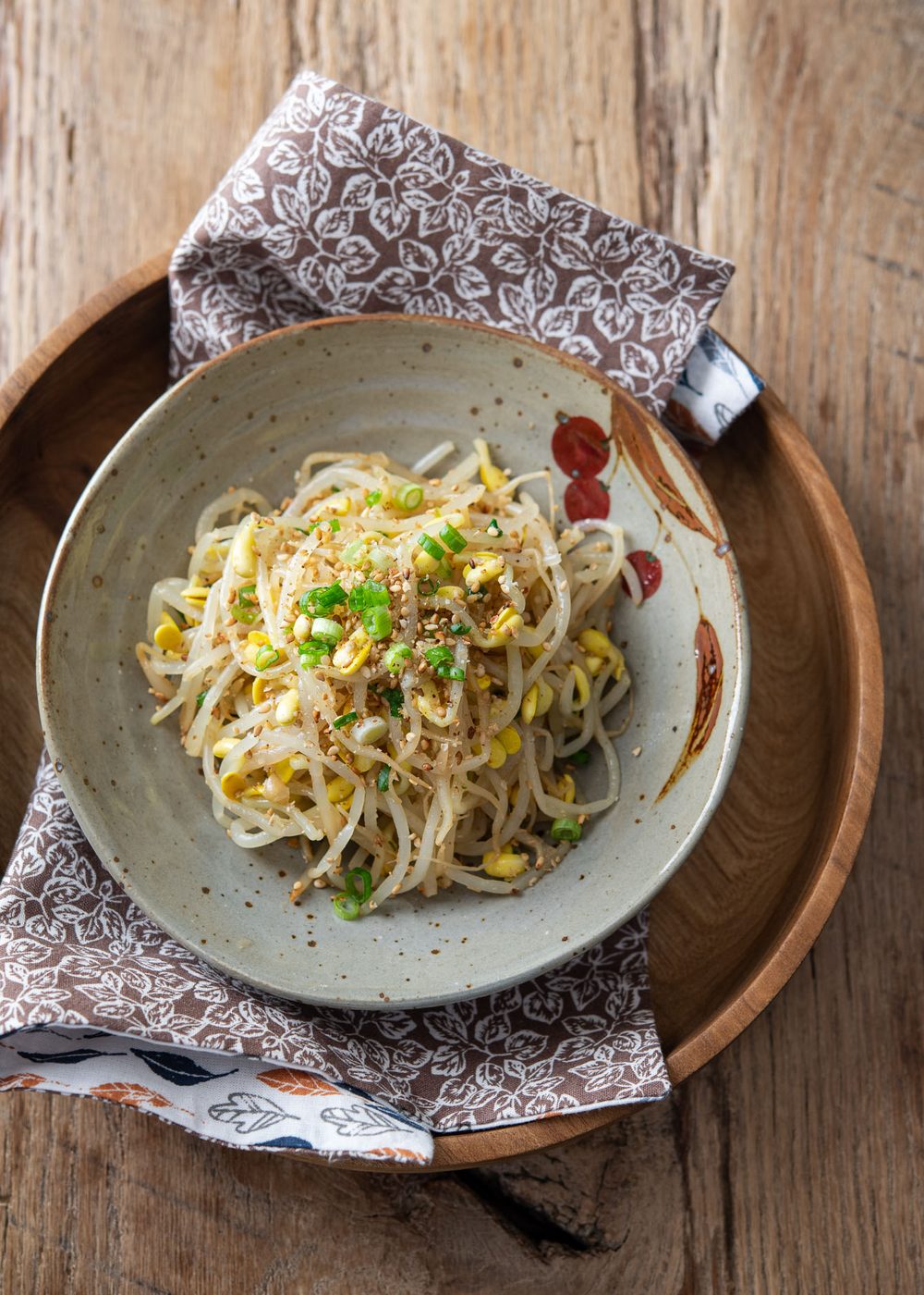 Korean soybean sprout side dish topped with toasted sesame seeds