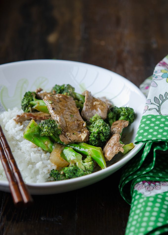 Beef broccoli stir-fry served with rice in a bowl as a rice bowl dish.