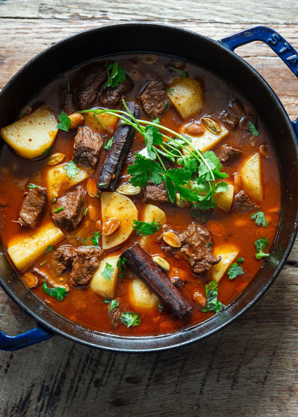 Thai beef massaman curry with potato and spice in a pot.