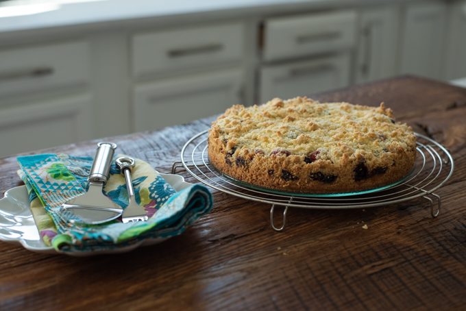 Buttery crisp crumb cake is layered with a moist berry filling