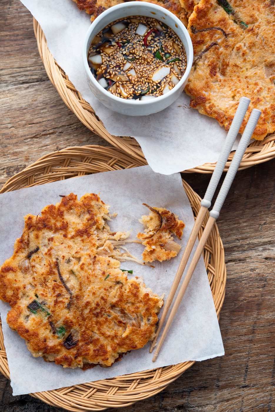 Korean bindaetteok ingredients laid out with mung beans, pork, kimchi, sprouts, and seasonings