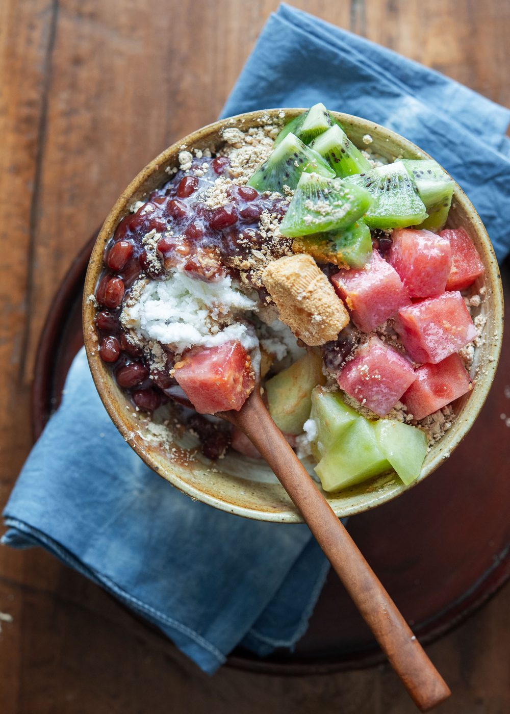 Korean shaved ice dessert in a bowl with a spoon.