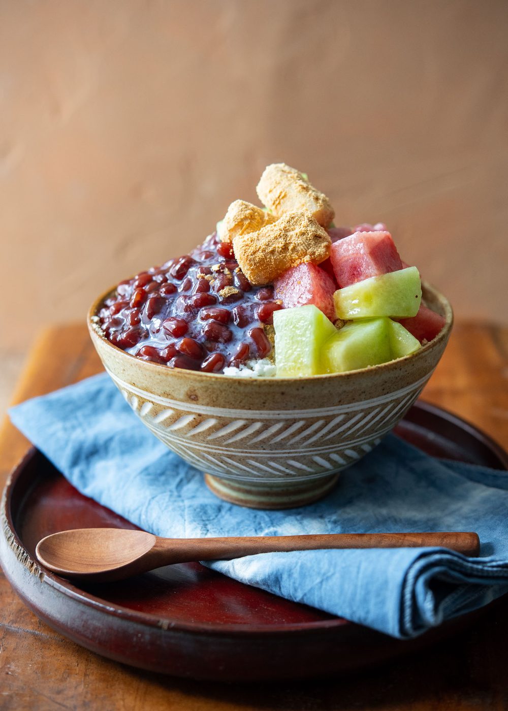 Patbingsu adorned with fresh fruits in a serving bowl.