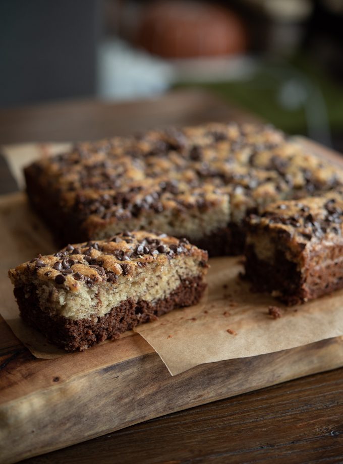 Black bottom banana cake is showing chocolate and banana cake layers.