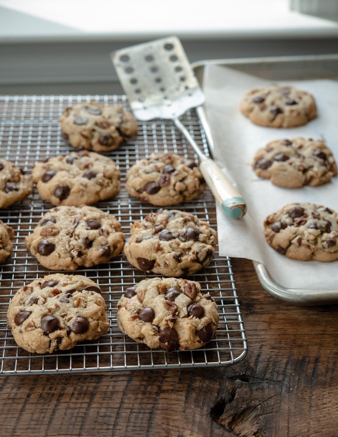 Brown butter chocolate chip cookies on a cooling rack.