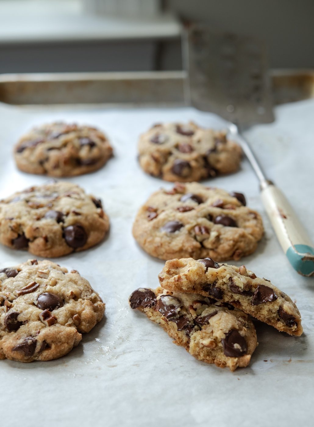 Chewy brown butter chocolate chip cookies on a cookie sheet.