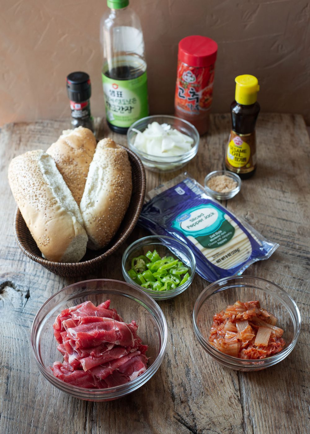 Ingredients for making bulgogi cheesesteaks are presented.