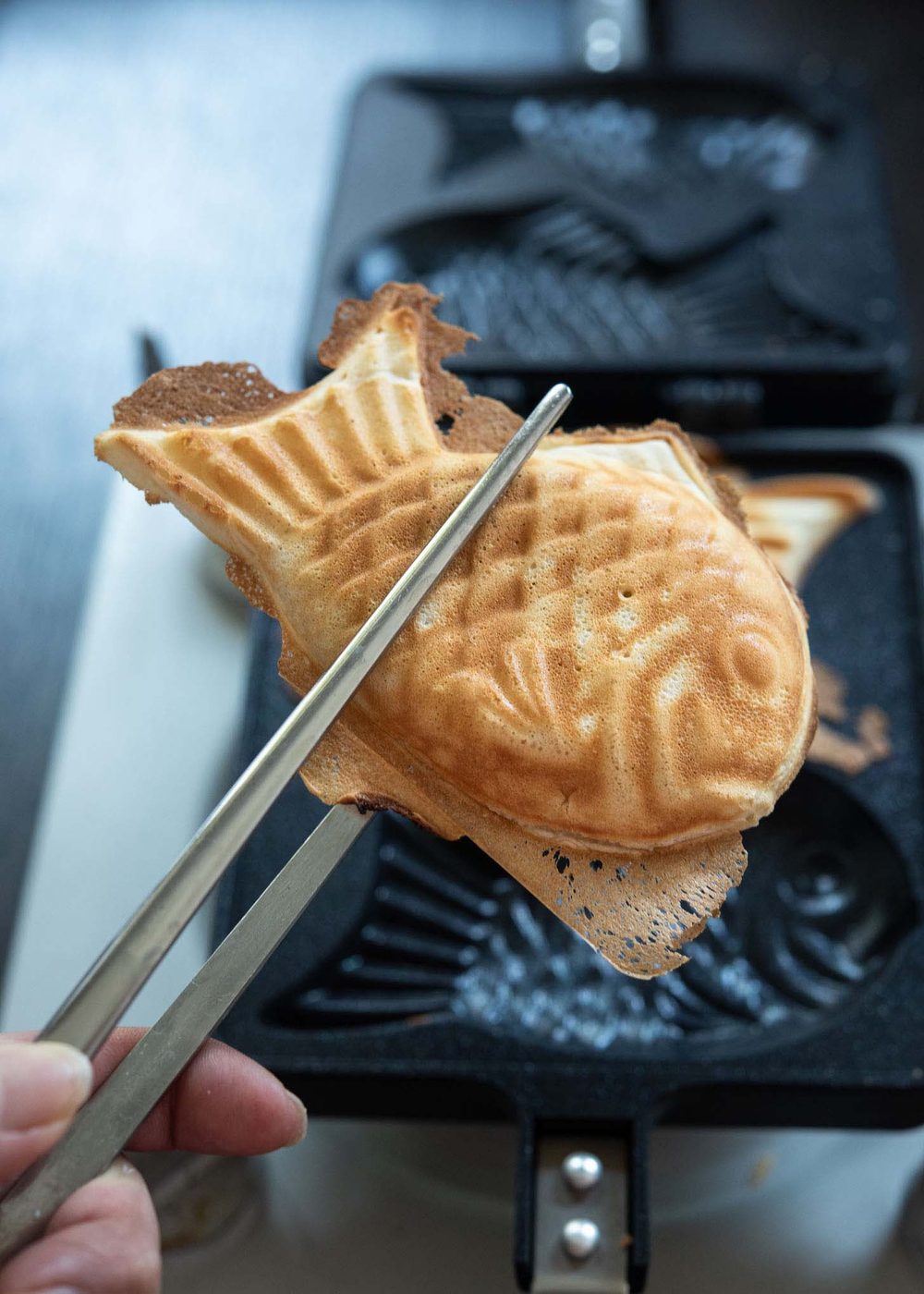 Golden, crispy bungeoppang out of fish shaped mold.