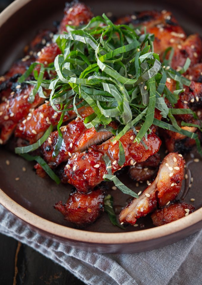 Chicken bulgogi made with Korean chili paste (gochujang) is garnished perilla leaves