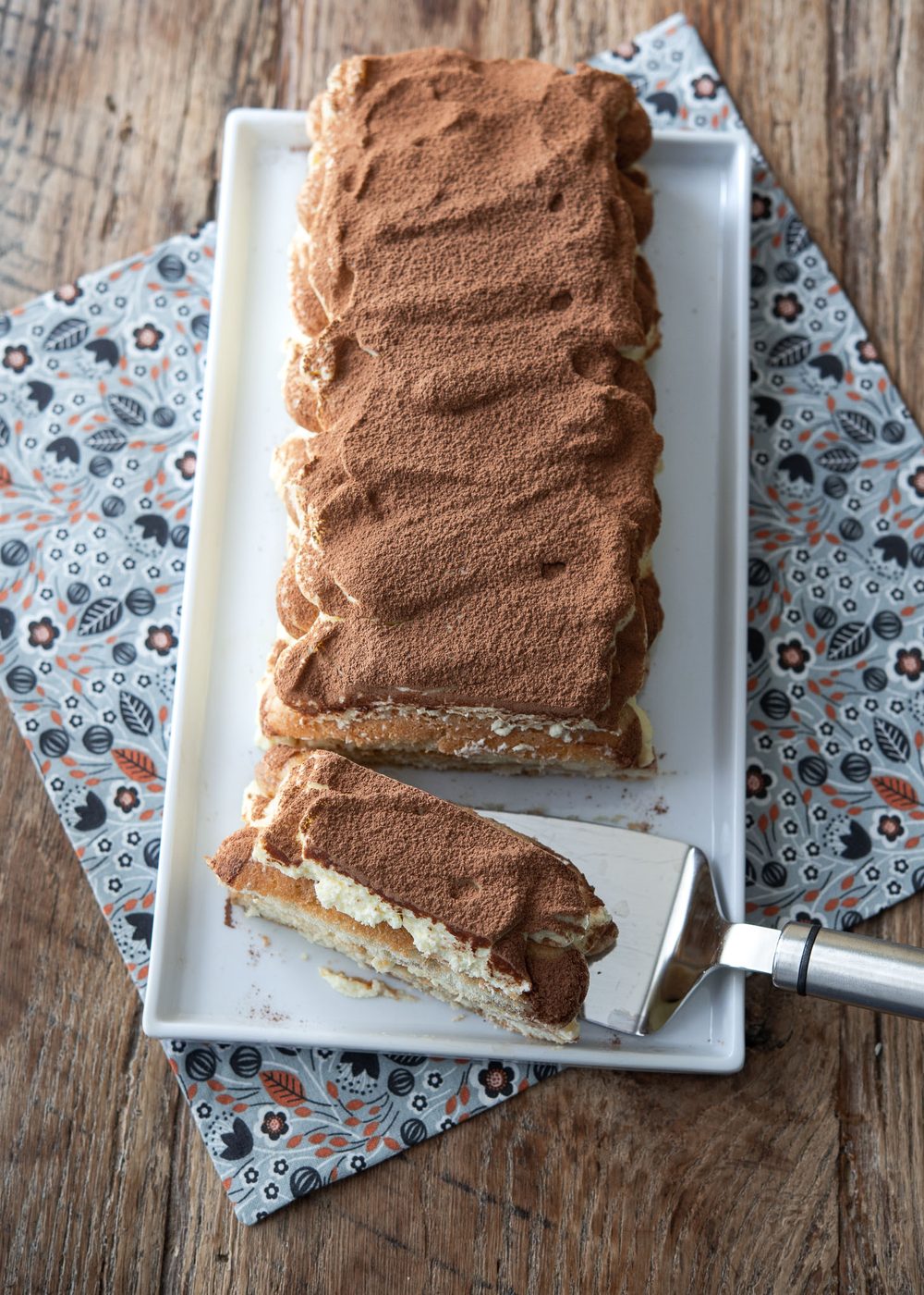 Coffee-free barley tiramisu is dusted with cocoa powder on top.
