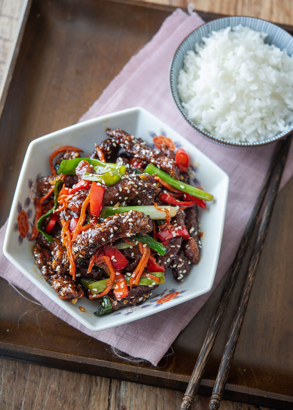 Sticky, glossy glazed Chinese crispy beef served with rice.