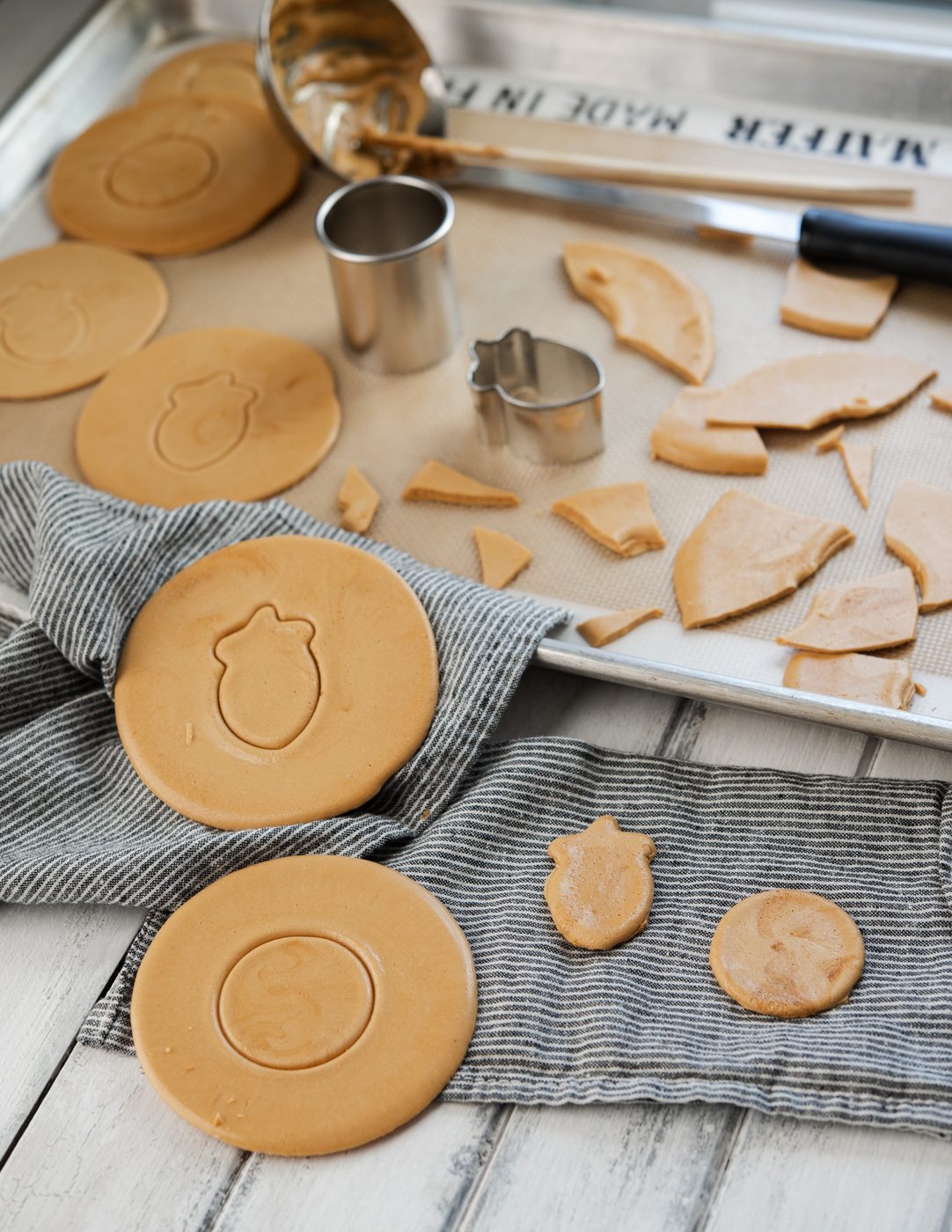 Dalgona (Korean sugar candy) pattern is picked out and presented over a napkin