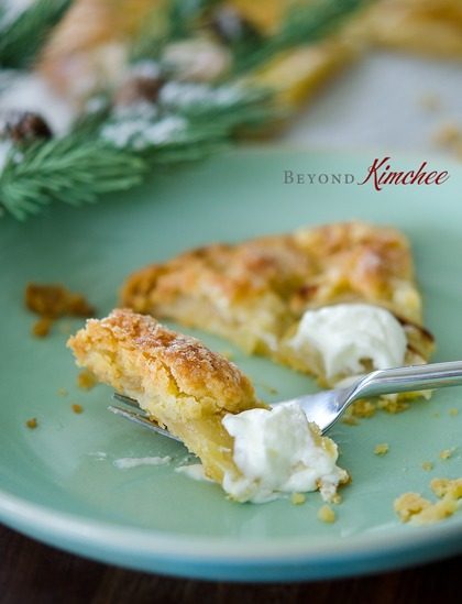 Apple tart (apple galette) is served with whipped cream.