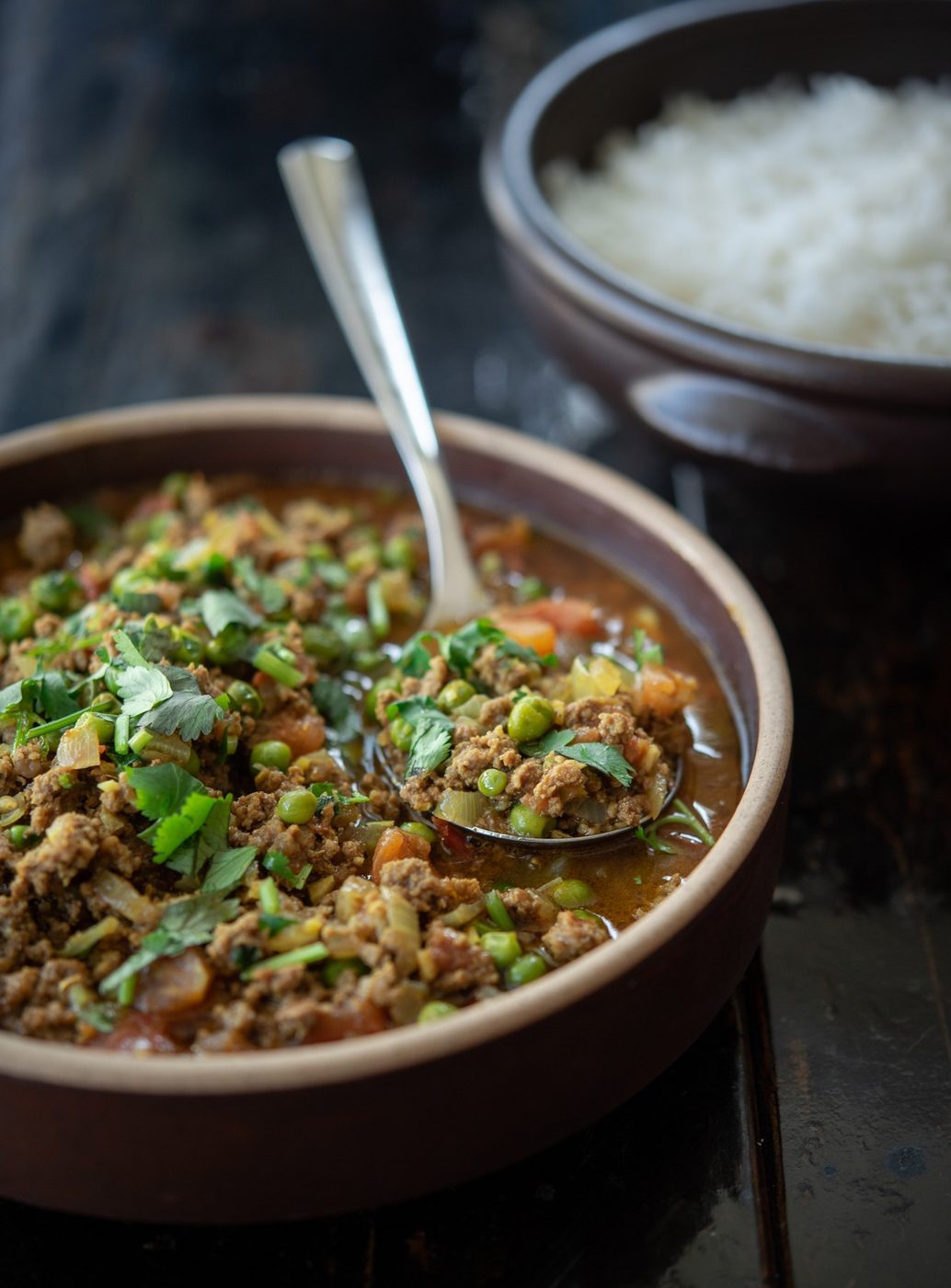 Serve this tomato based ground beef curry over rice for a direct dinner.
