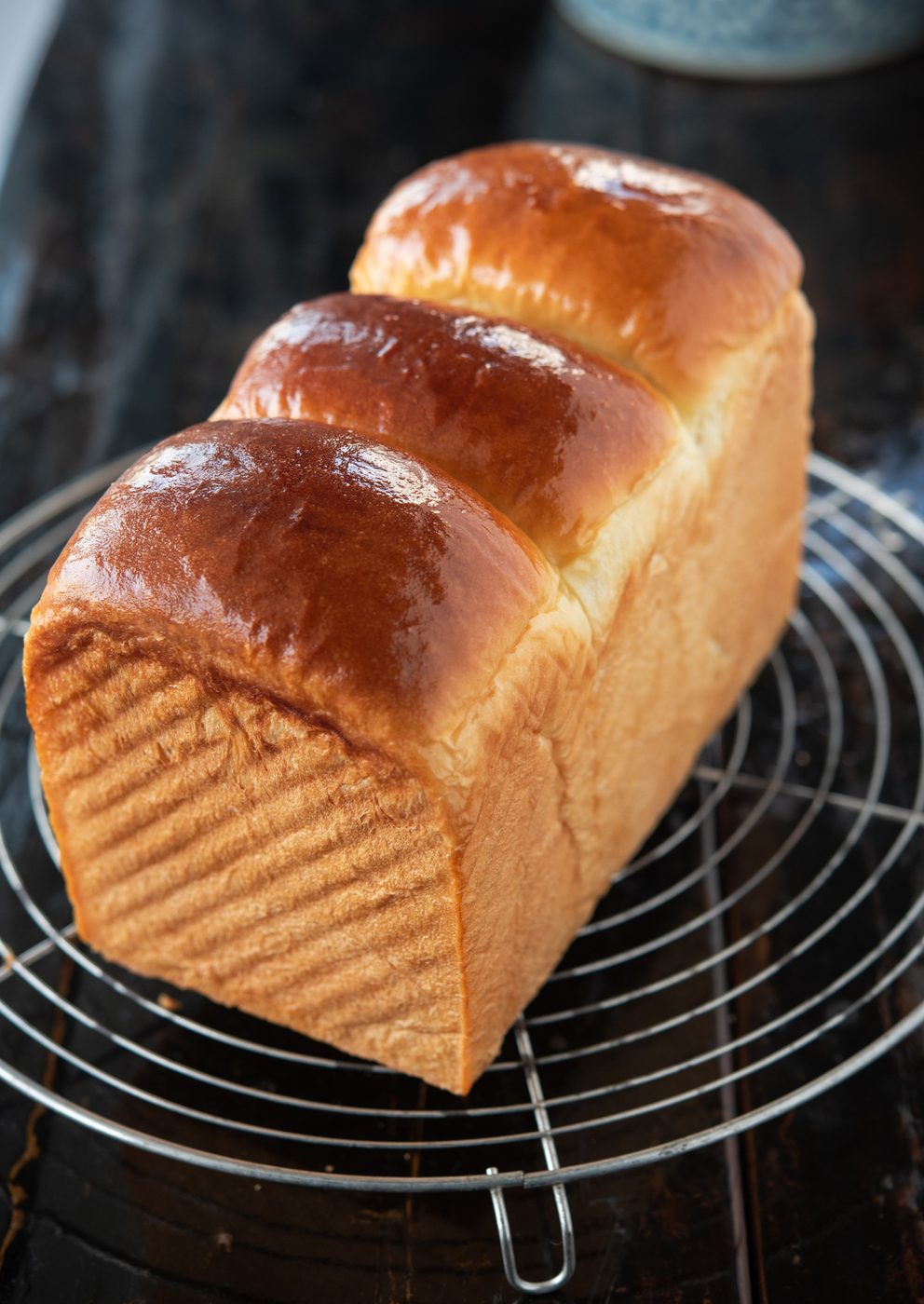 Japanese milk bread loaf (shokupan) with a golden brown crust