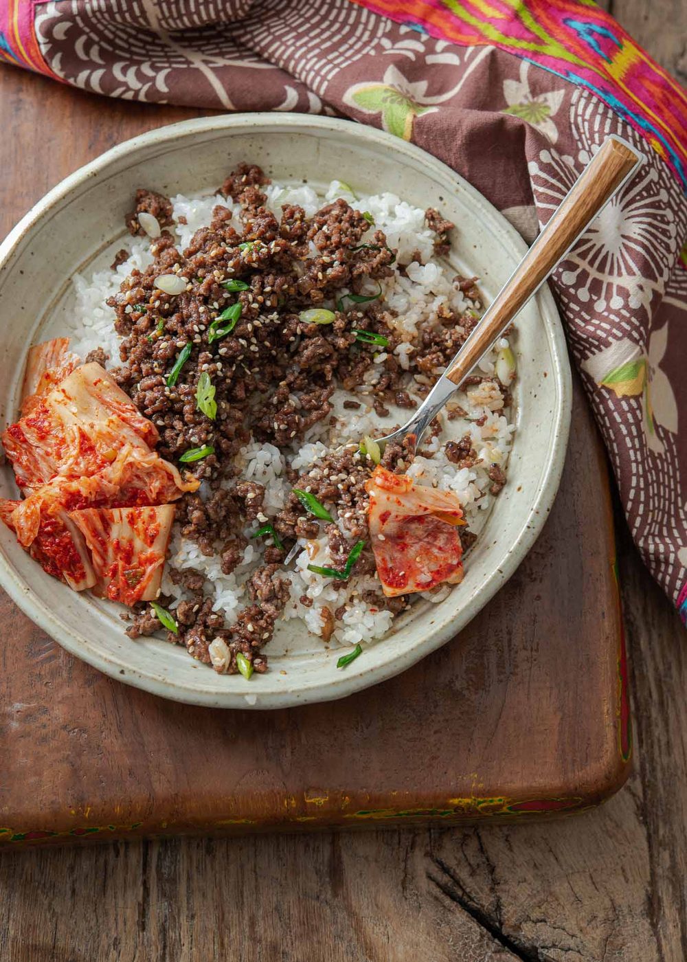 Korean ground beef bulgogi with kimchi in a serving dish.
