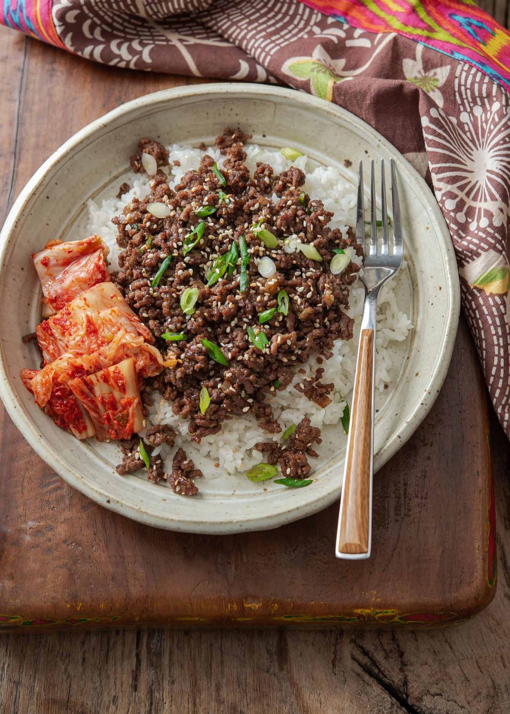Korean beef bowl made with ground beef bulgogi and kimchi in a serving bowl.