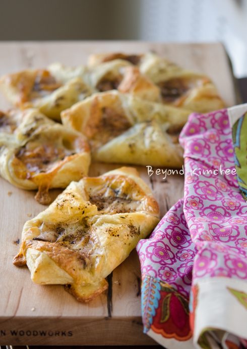 Ham and cheese pastry puffs are sprinkled with spice mixture.