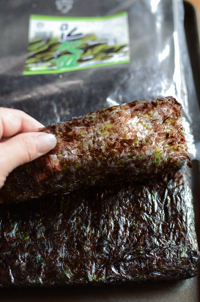 Plain raw dried seaweed sheets for making seaweed snacks have rough texture.