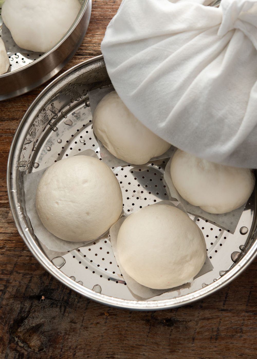 Freshly steamed hoppang buns with fluffy texture in a steamer