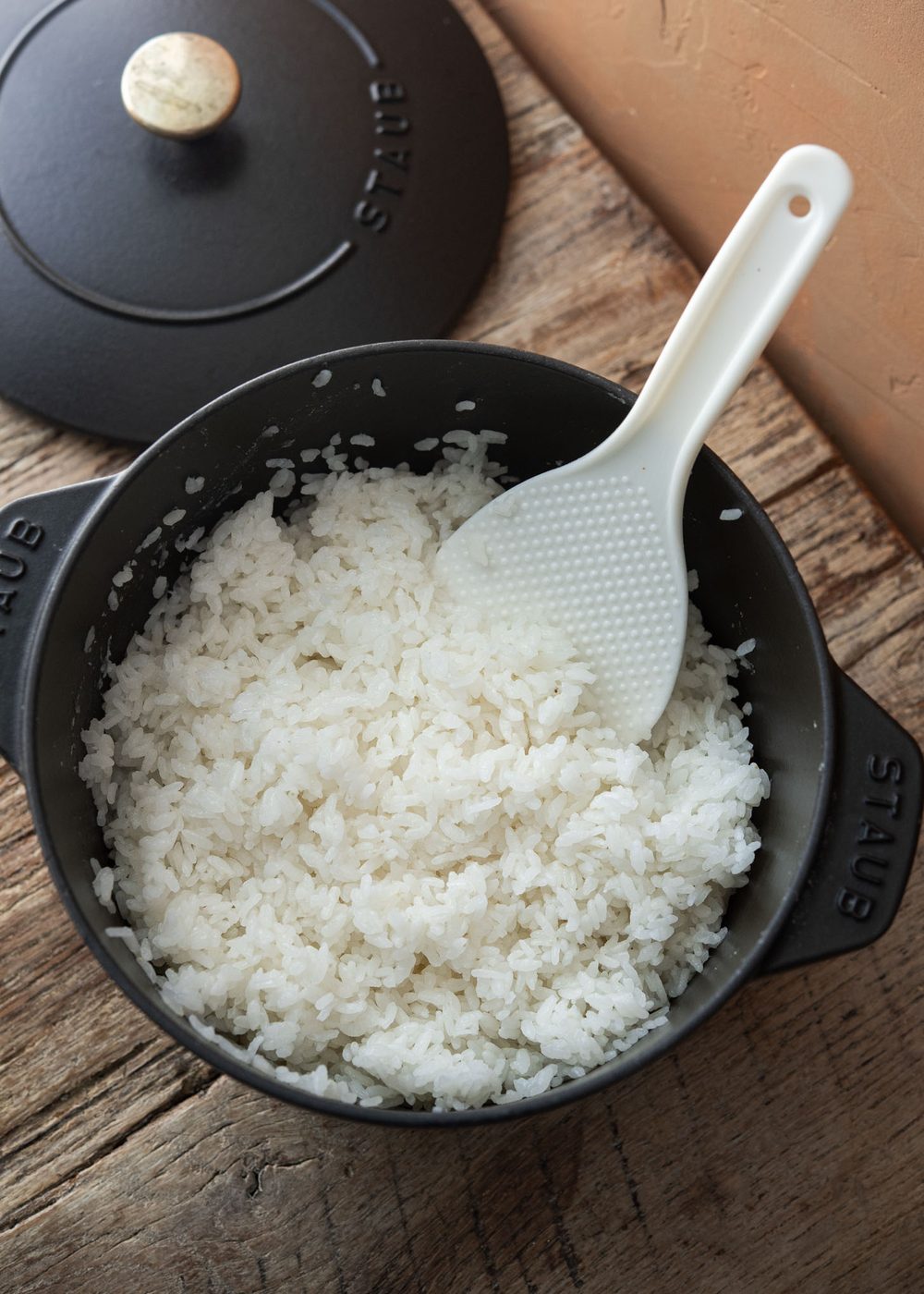 Freshly cooked Korean short-grain rice in a black heavy-bottomed pot