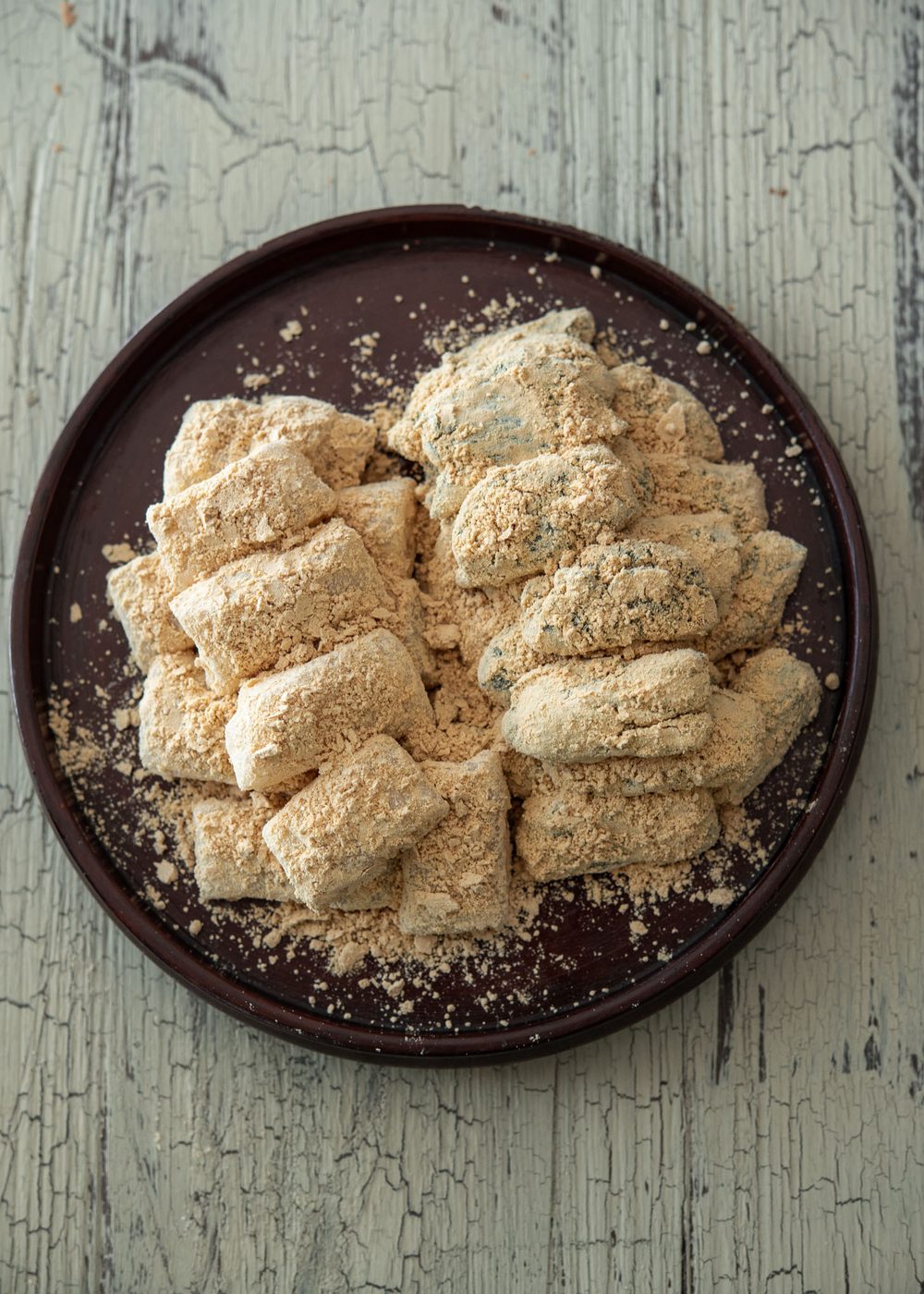 2 flavors of rice cake dessert, injeolmi, coated with roasted soybean powder