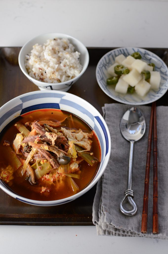 Spicy Korean beef stew served with rice and side dish.