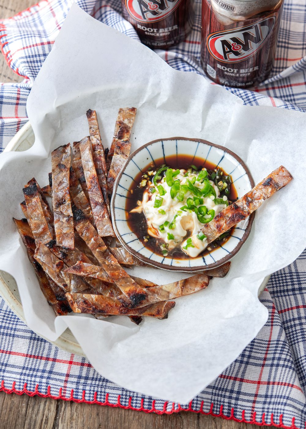 Strips of jwipo is served with soy mayo chili dipping sauce on the side.