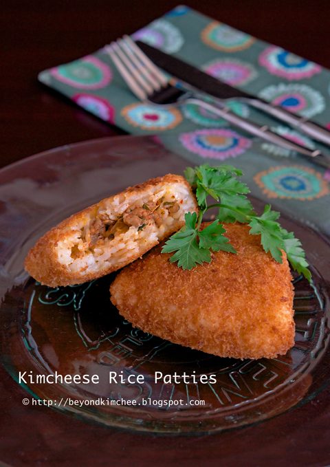 Kimchi rice patties with filling on a serving dish.
