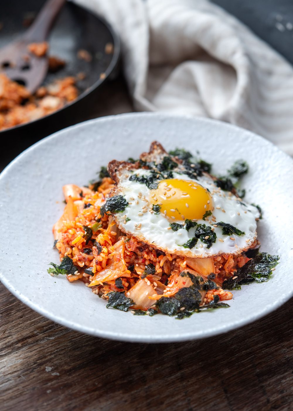 Classic kimchi fried rice topped with a sunny-side-up egg and roasted seaweed crumble