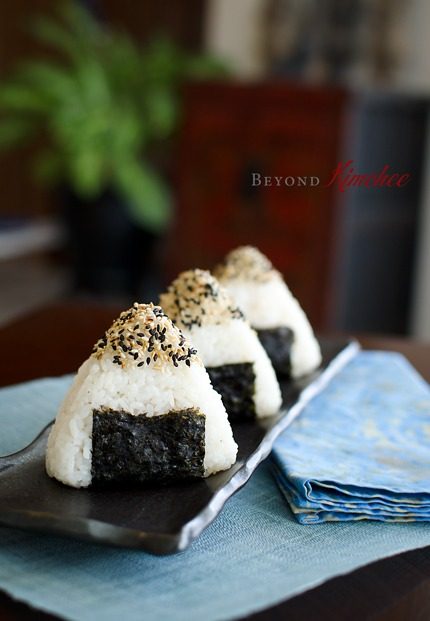 Kimchi Tuna onigiri are dipped in sesame seeds