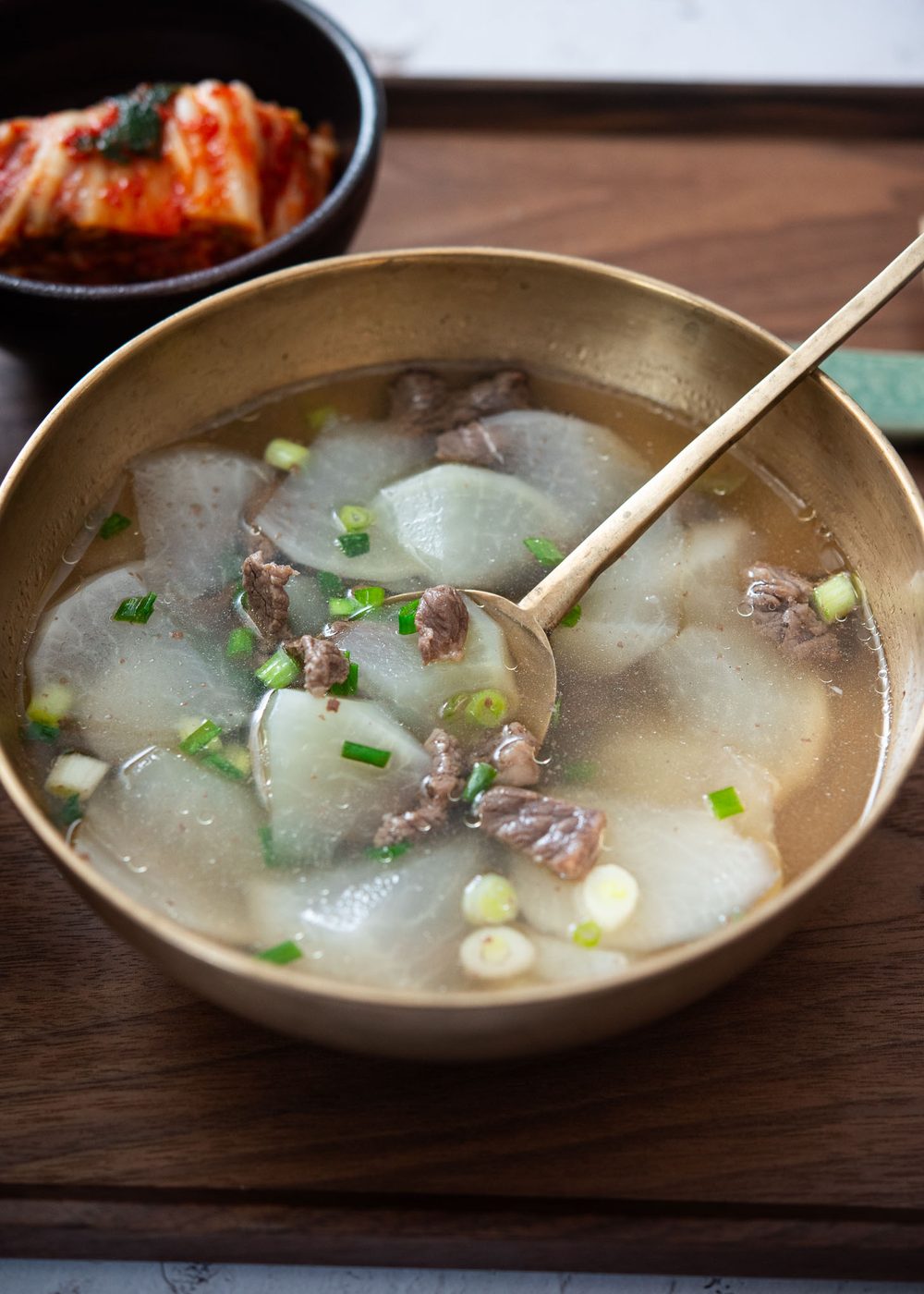 Korean beef radish soup (sogogi muguk) served in a bowl with a s