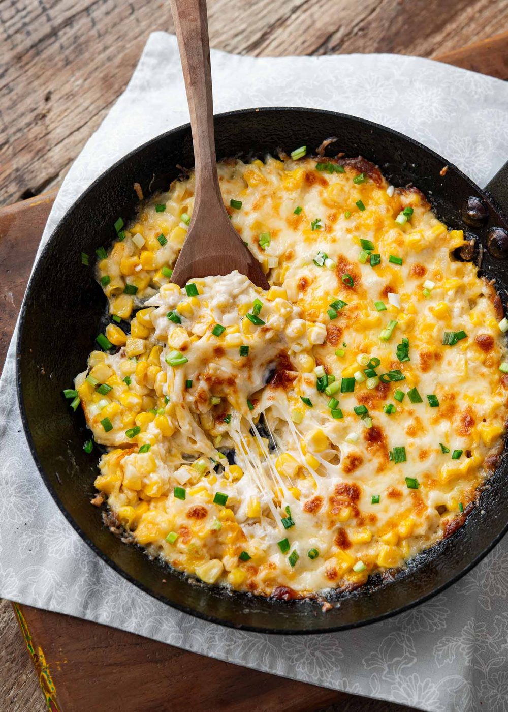 Cheesy Korean corn cheese baked in a cast iron skillet.