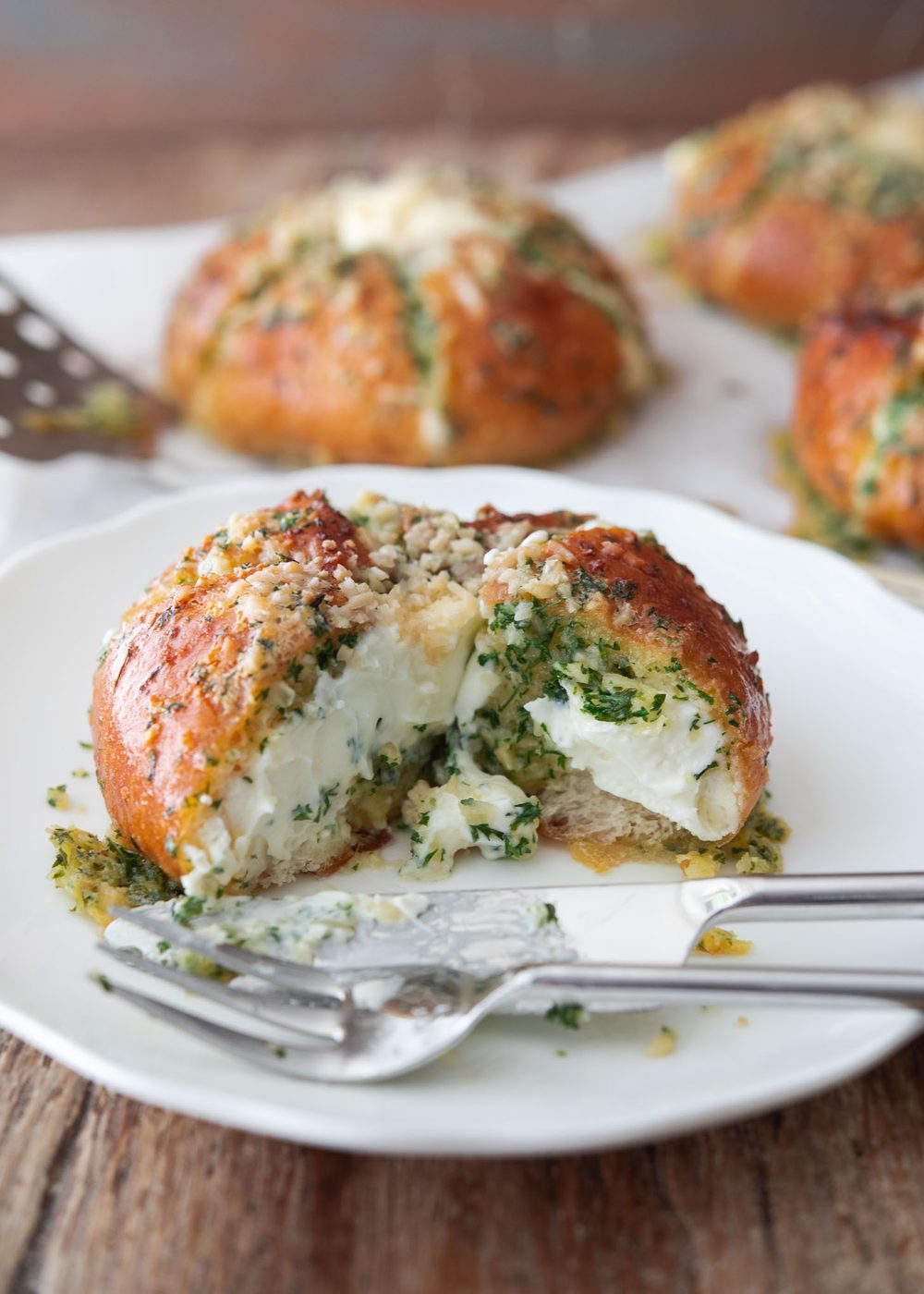 Sweet cream cheese filling inside sliced Korean garlic bread buns