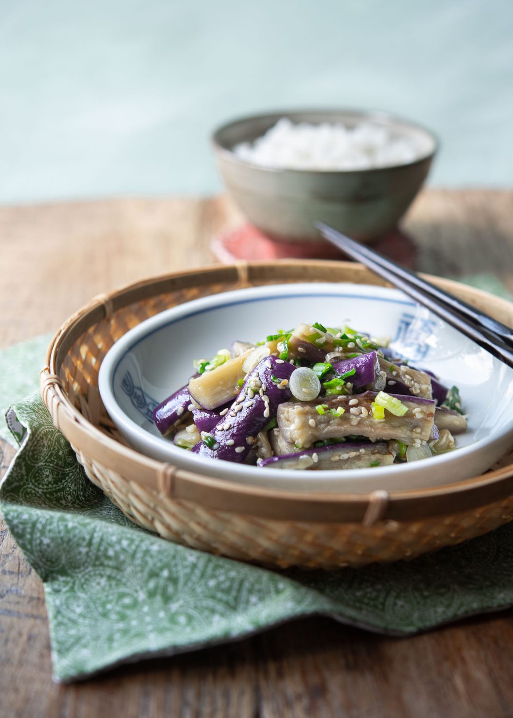 Gaji Namul (Korean eggplant banchan) garnished with sesame seeds and green onion.