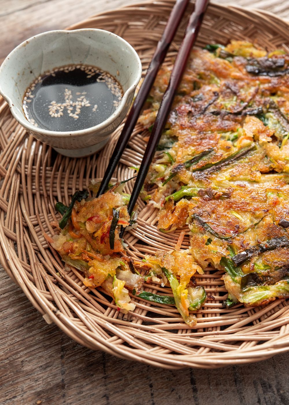 Crispy yachaejeon served with soy dipping sauce on the side