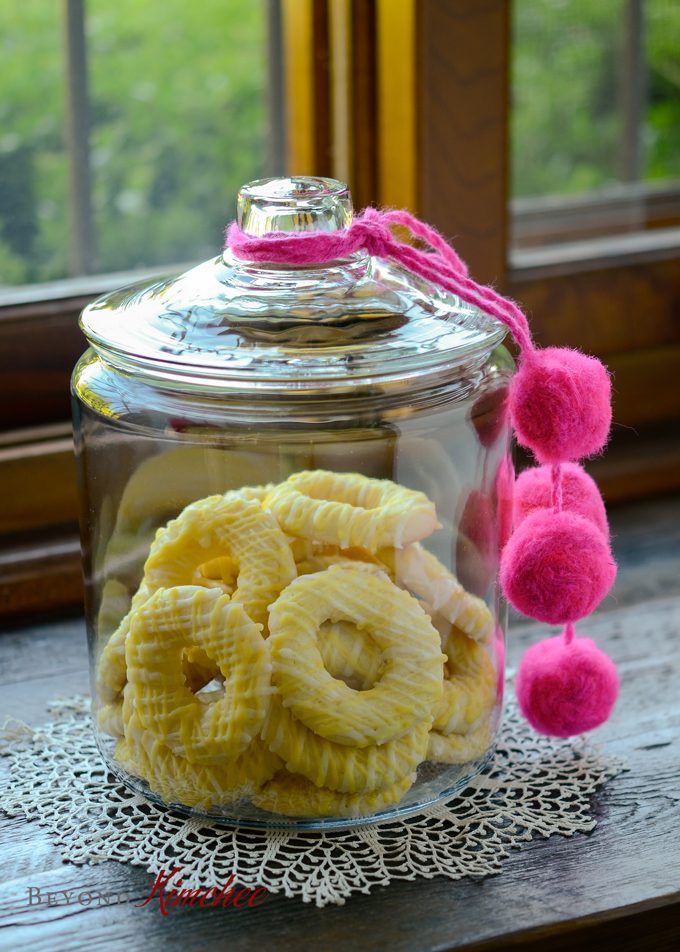 Lemon Jumbles (Lemon ring cookies) stored in a cookie jar.
