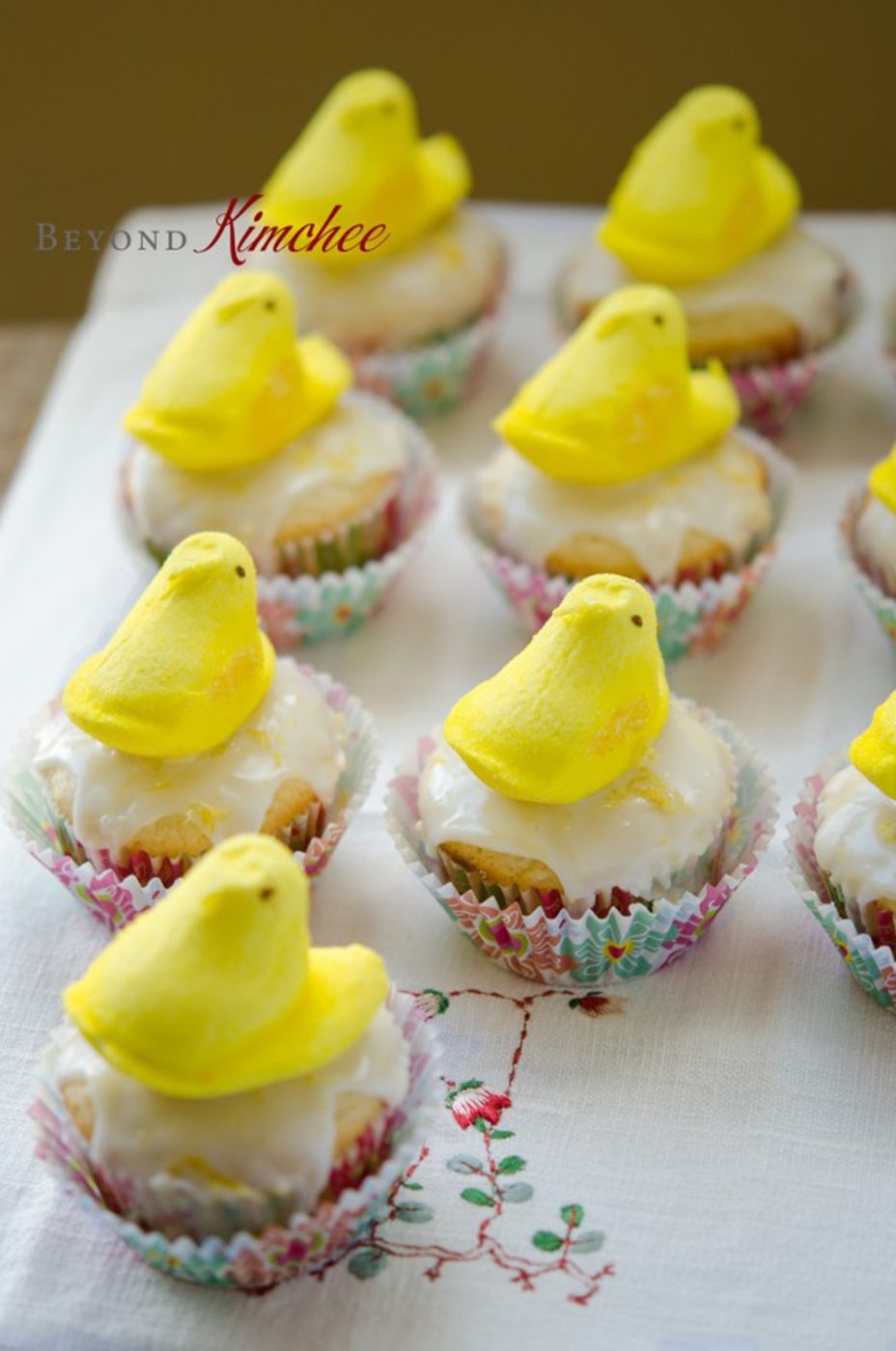 Lemon yogurt cupcakes with marshmallow Peeps displayed.