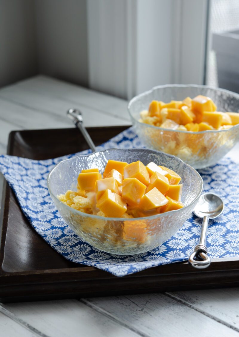 Kitchen-made milky shaved ice (bingsu) is topped with fresh mango