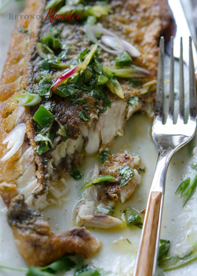 Mexican style grilled fish is topped with cilantro green onion sauce
