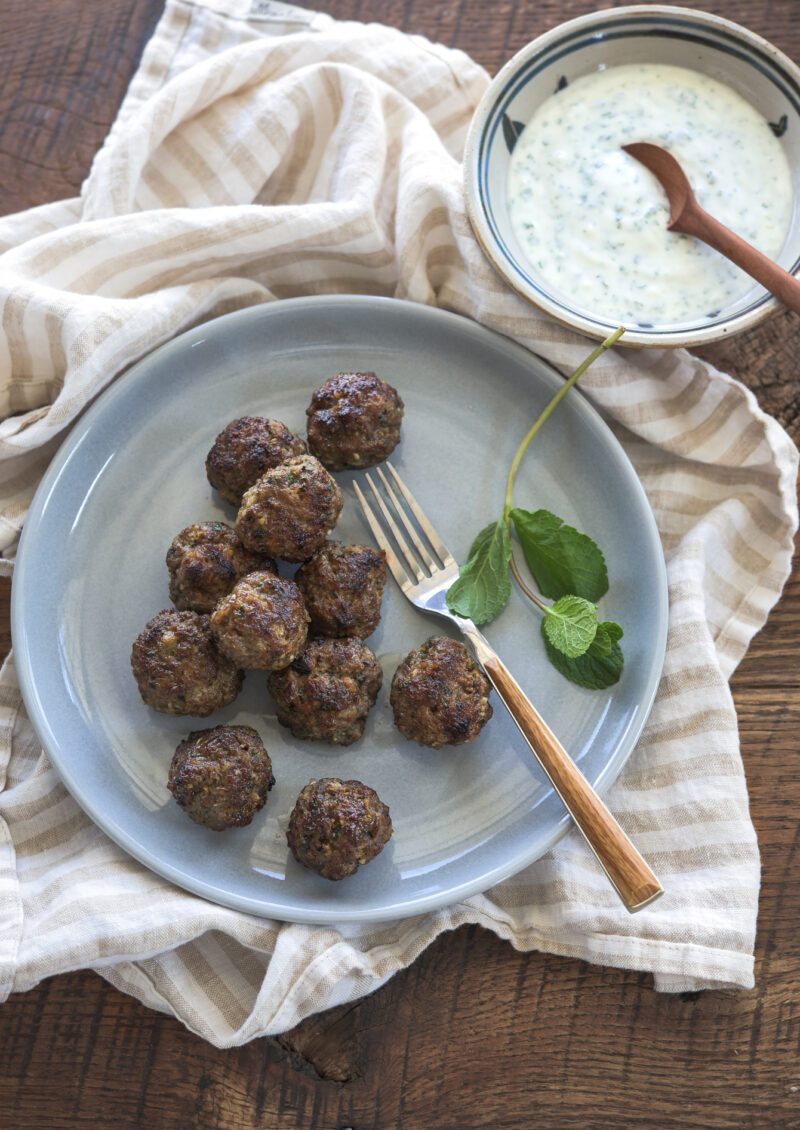 Middle eastern meatballs served with mint yogurt dip.