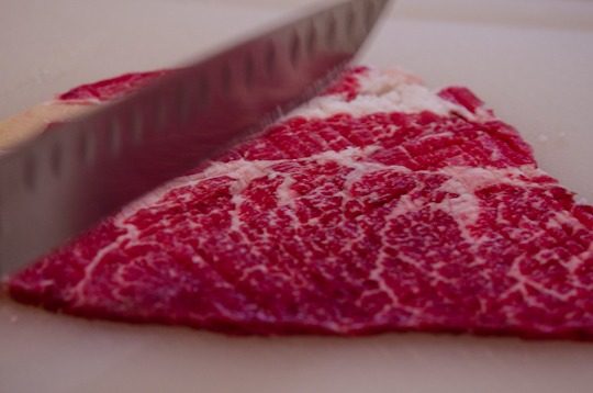 Back of knife pounding beef.