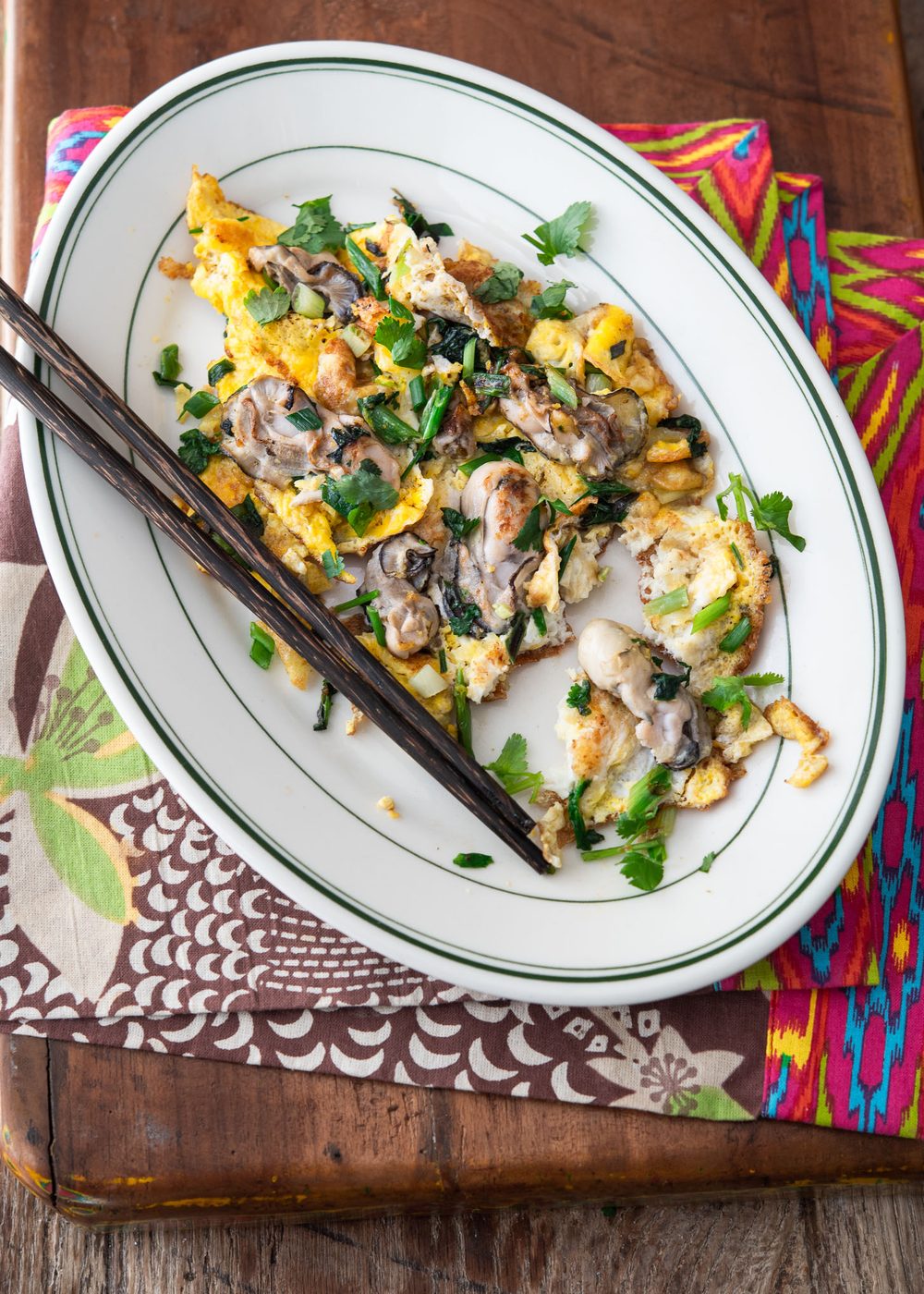 Oyster omelette with chopsticks.