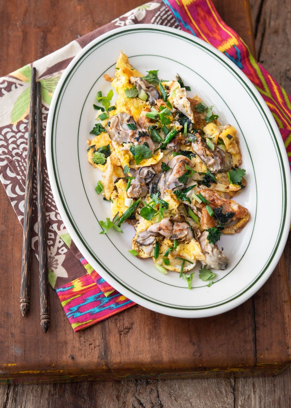 Oyster omelette with chopsticks.