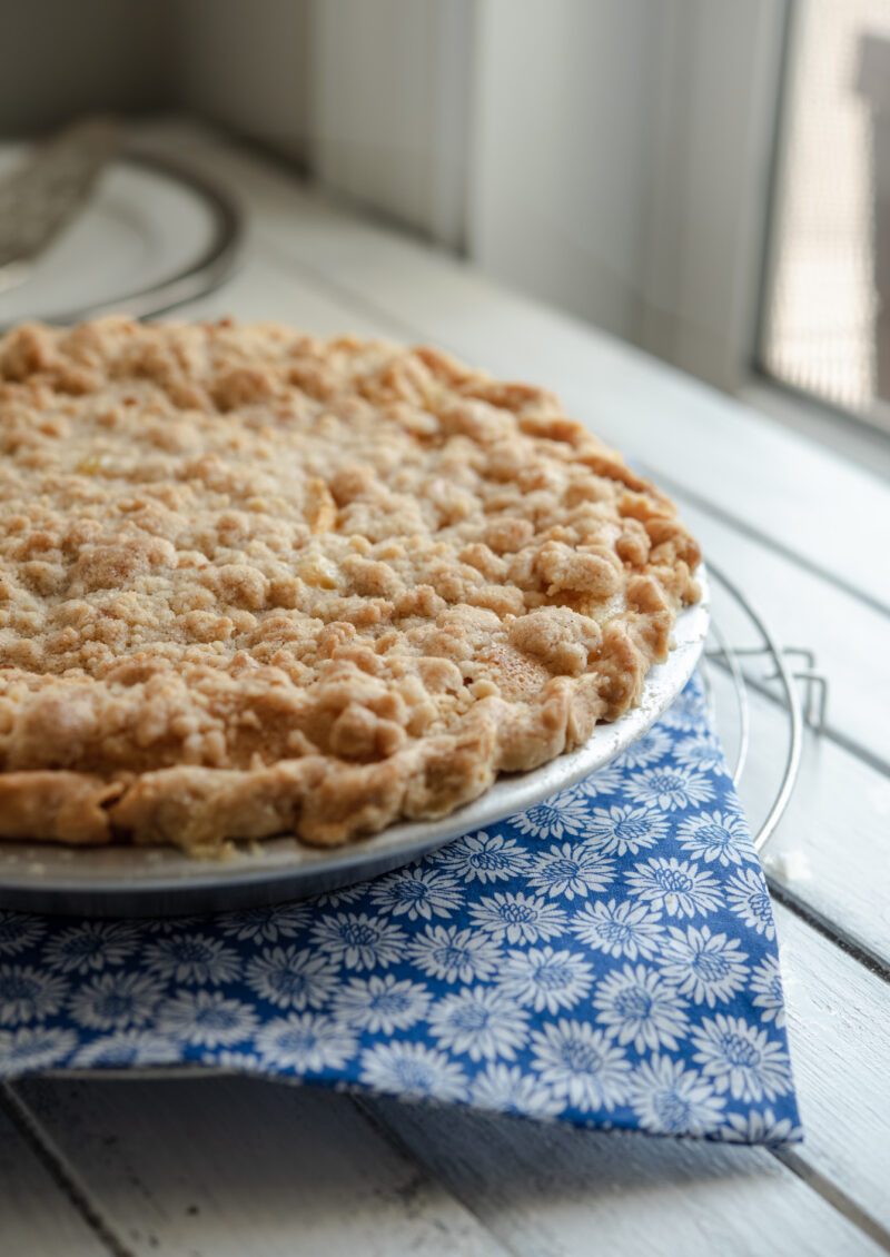 Peach custard pie with streusel topping.
