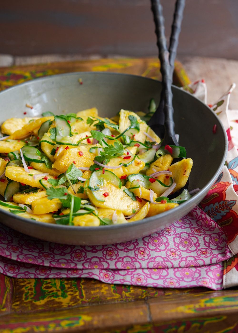 Asian flavored pineapple cucumber salad in a bowl.