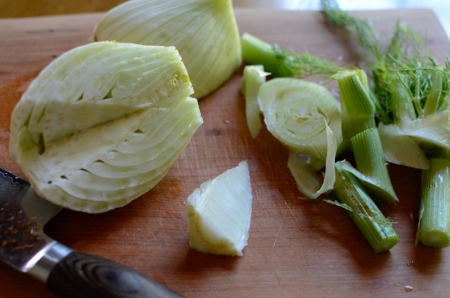 Fennel cored on a cutting board.